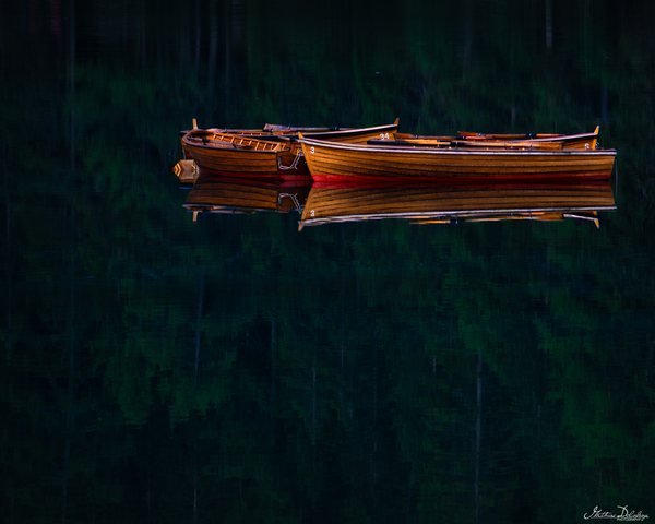 Small Wooden Boat Floating on the Pragser Lake
